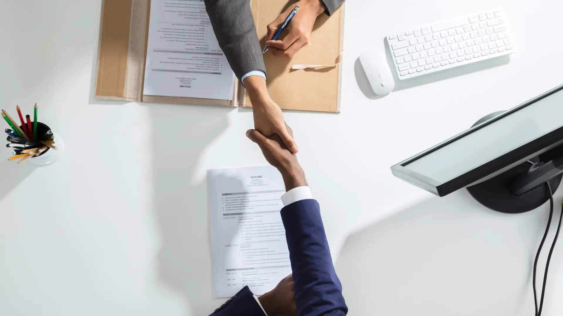 Two people shaking hands representing Asda deals