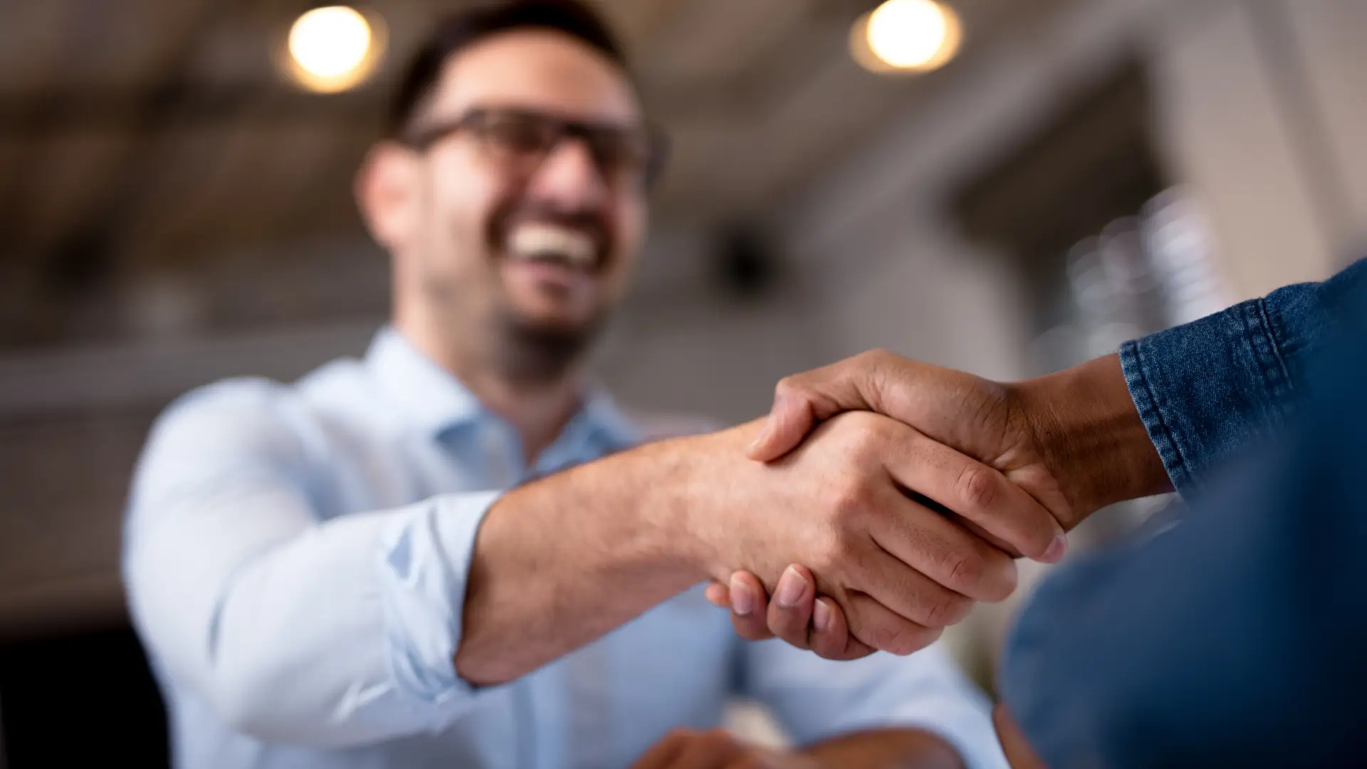 Two happy boys shaking hands representing Bt deals