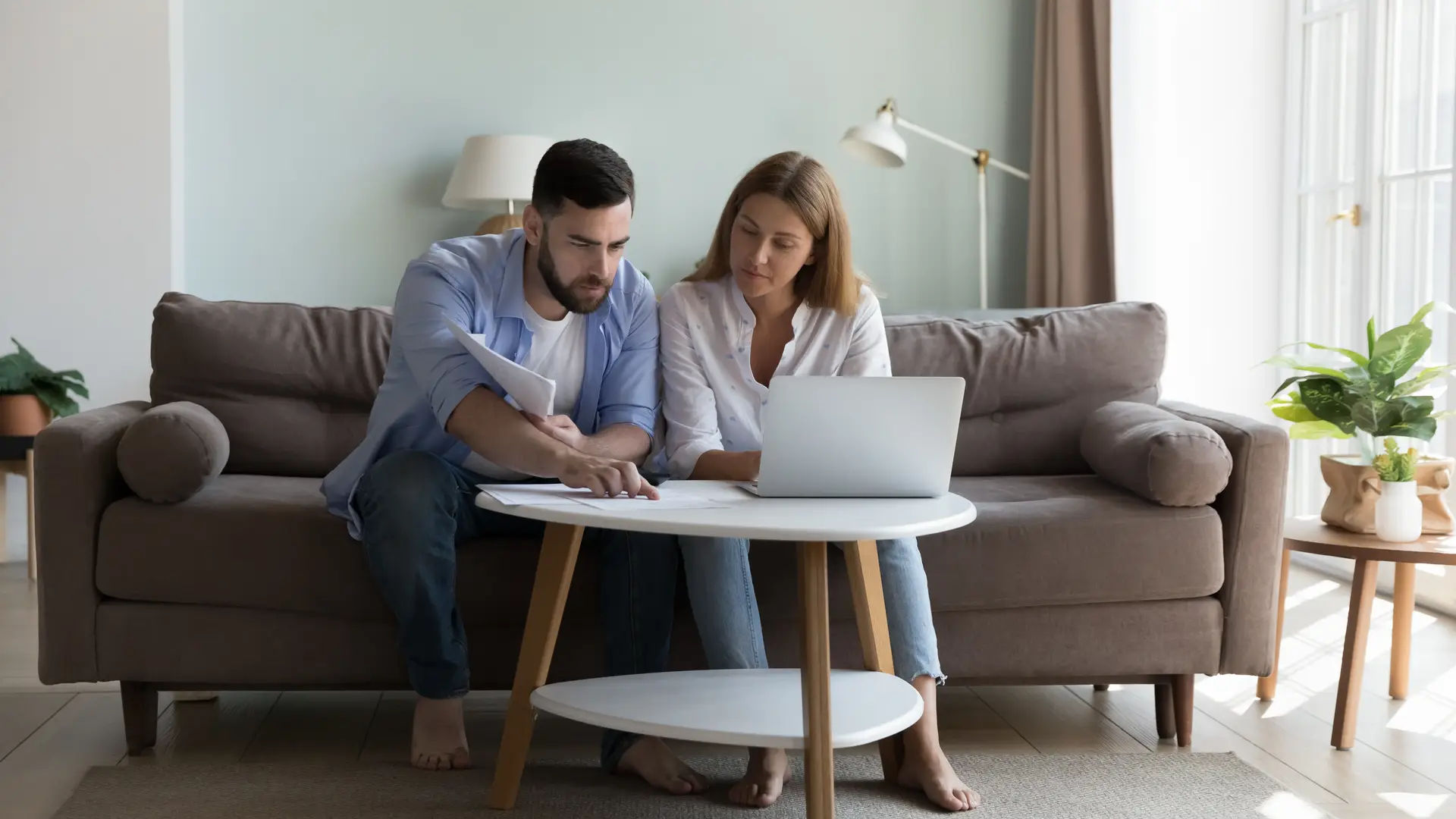 Young couple searching on internet how to track order with BT