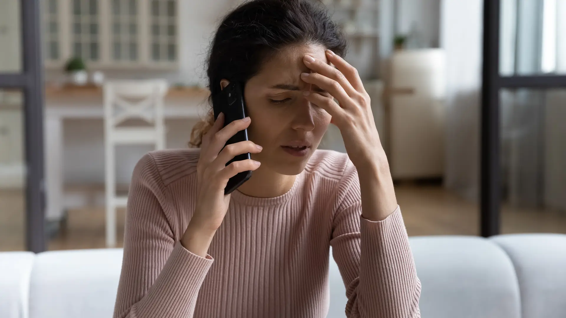 Women talking on his phone with SSE customer service