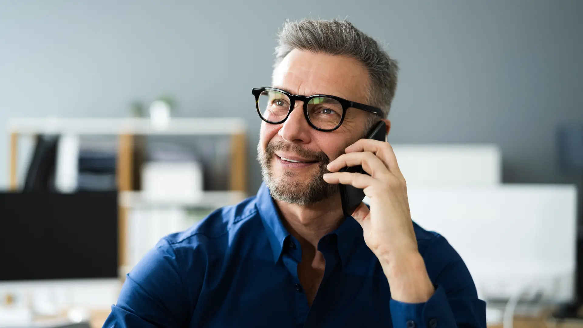 Men talking on his phone with Talktalk customer service