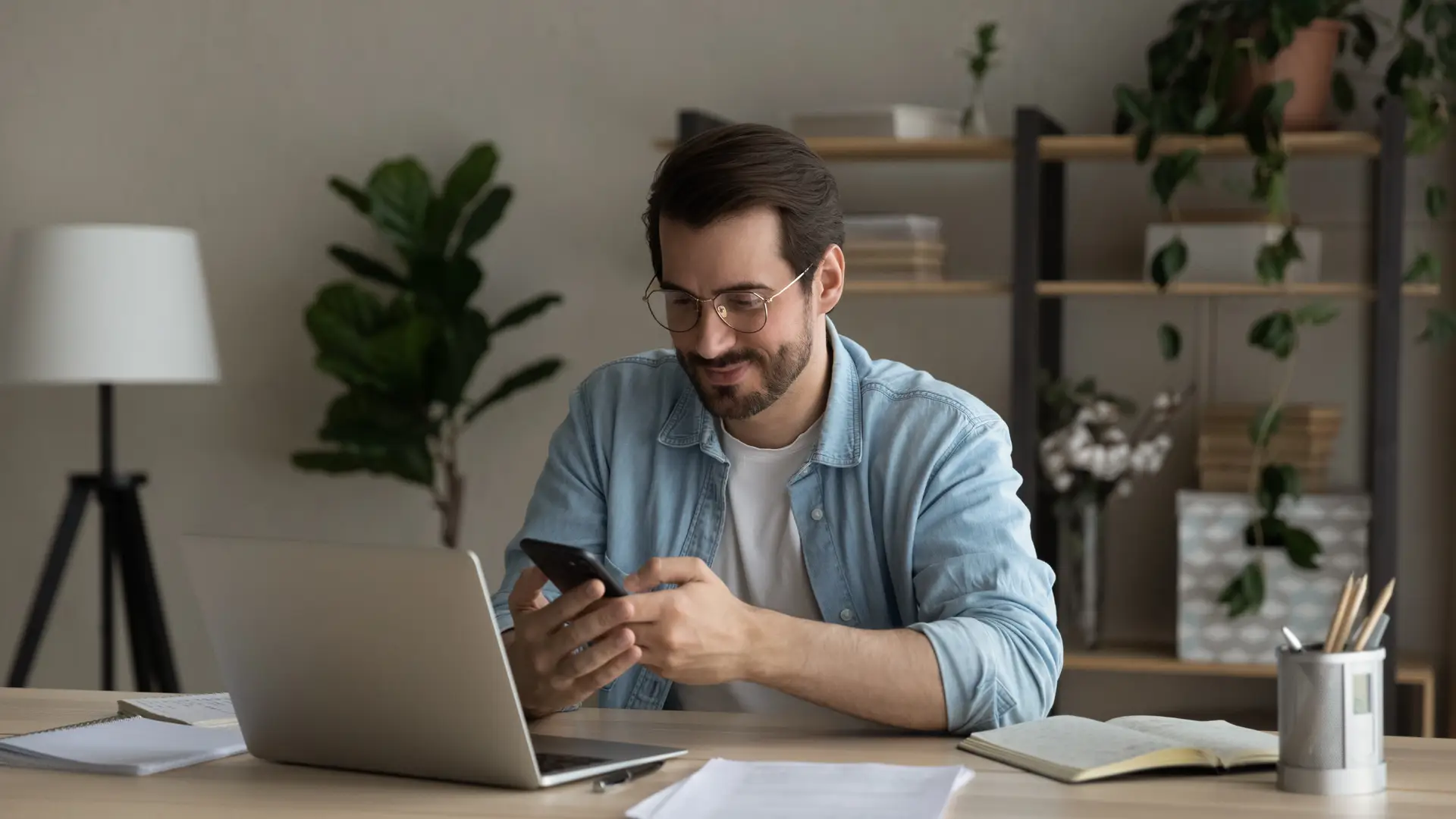 Men usign his phone to discover how to cancel Virginmedia 