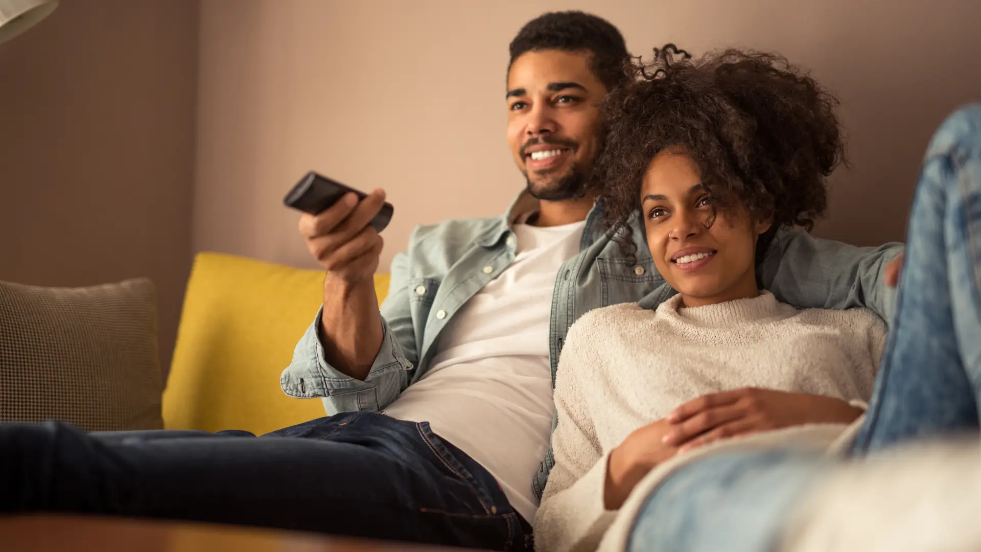 Young couple enojoying the Virginmedia tv box